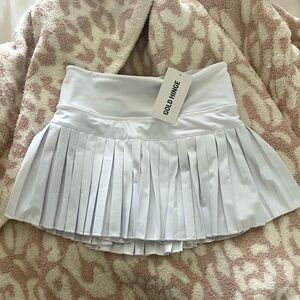 Selling this new gold hinge skirt